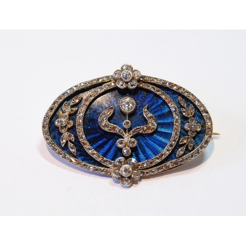 132 - Victorian gold oval brooch with ovals, sprays and collets of rose and brilliant diamonds upon blue g... 