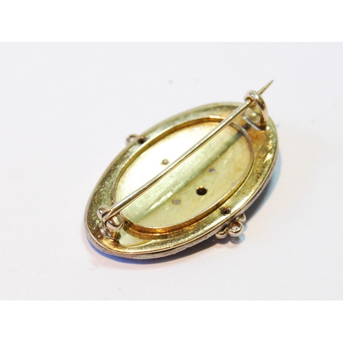 132 - Victorian gold oval brooch with ovals, sprays and collets of rose and brilliant diamonds upon blue g... 