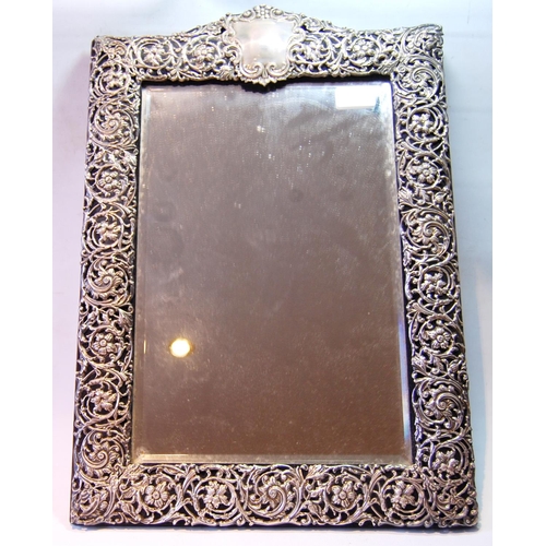 135 - Victorian silver easel mirror with embossed openwork border, by Henry Matthews, Chester 1900, 52cm x... 