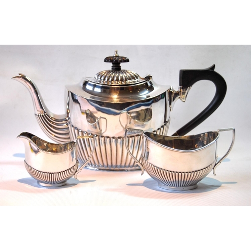 136 - Silver three-piece tea set, oval fluted, Chester and Birmingham 1904/5, 495g or 15½oz.