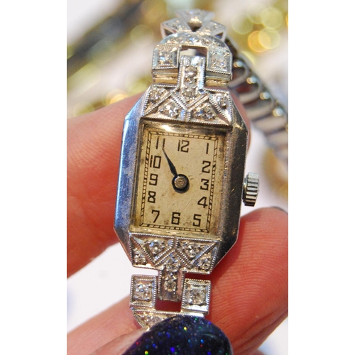 138 - Lady's diamond and platinum evening watch, now quartz, on steel bracelet, a cameo brooch in 9ct gold... 