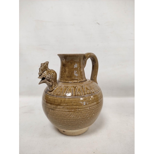 144 - Early Chinese, possibly Tang dynasty, pottery ewer, part yellow glazed, 18cm high and a brown glazed... 