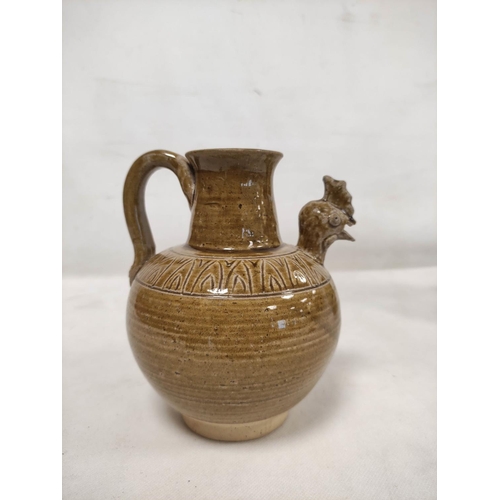 144 - Early Chinese, possibly Tang dynasty, pottery ewer, part yellow glazed, 18cm high and a brown glazed... 