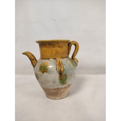 144 - Early Chinese, possibly Tang dynasty, pottery ewer, part yellow glazed, 18cm high and a brown glazed... 