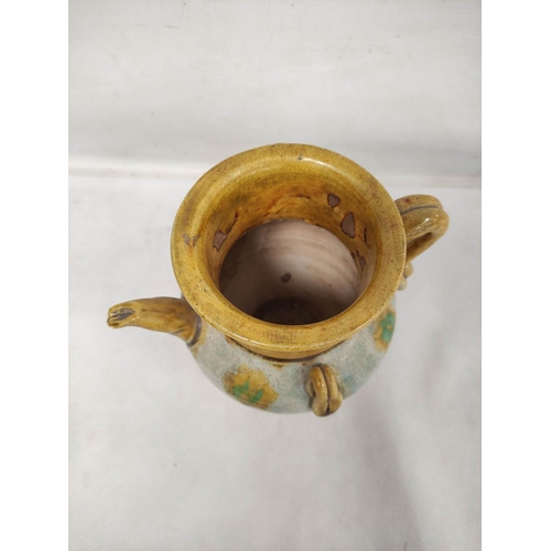 144 - Early Chinese, possibly Tang dynasty, pottery ewer, part yellow glazed, 18cm high and a brown glazed... 