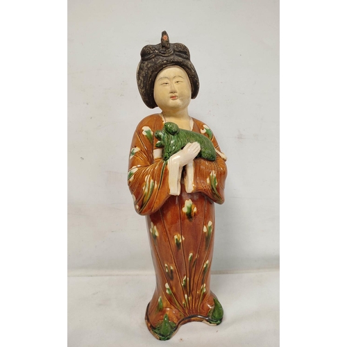 151 - Large Chinese sancai pottery figure of a Tang dynasty court lady with lapdog, 64cm high.