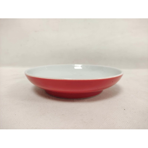 155 - 19th century Chinese grey porcelain crackle ware bowl and cover, 10cm high and a red glazed saucer d... 