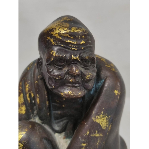 160 - 19th century Chinese bronze figure of a seated mendicant with alms bowl, traces of gilding, 18cm hig... 