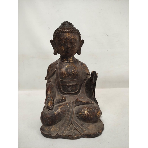 162 - Chinese bronze statue of the seated Buddha, traces of gilding, Qianling mark, 28cm high.