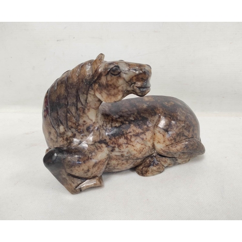 192 - Large Chinese grey and brown hardstone carving of a reclining horse, 14cm high, 19cm long.