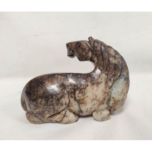 192 - Large Chinese grey and brown hardstone carving of a reclining horse, 14cm high, 19cm long.