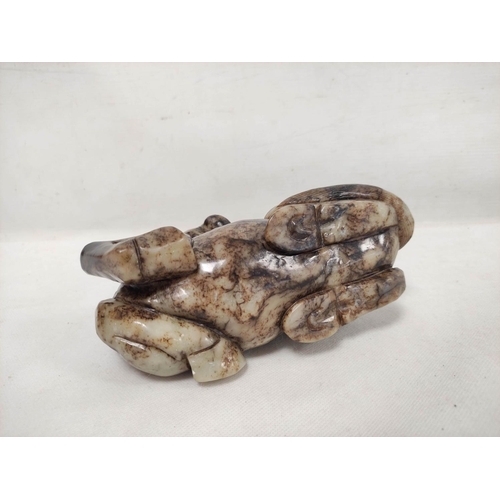 192 - Large Chinese grey and brown hardstone carving of a reclining horse, 14cm high, 19cm long.