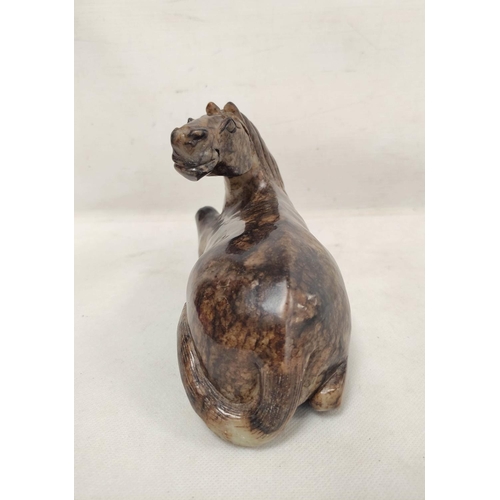 192 - Large Chinese grey and brown hardstone carving of a reclining horse, 14cm high, 19cm long.