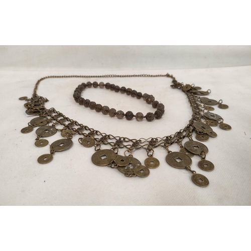 193 - Long Chinese metal 'coin' necklace and a short Chinese necklace of well carved Peking glass beads.&n... 