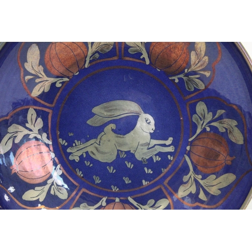 313 - Jonathan Chiswell Jones East Sussex studio pottery plate with central panel of a running hare surrou... 