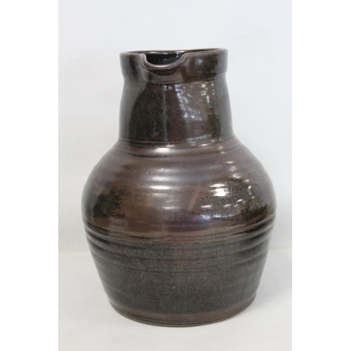 316 - Harry and May Davis Crowan Cornish studio pottery jug of baluster form with tenmoku glaze, with impr... 