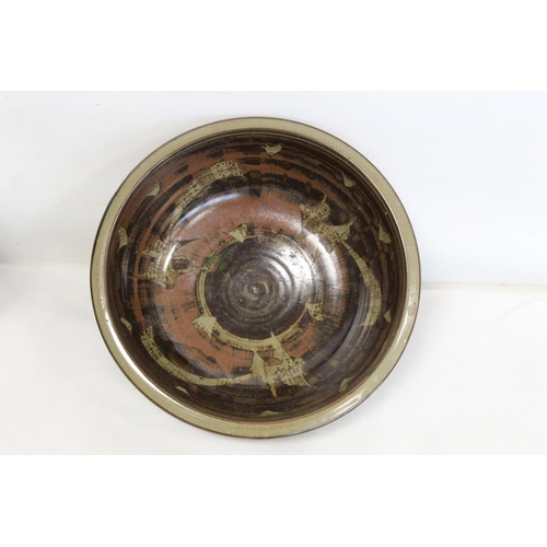 317 - Harry and May Davis Crowan Cornish studio pottery bowl of circular form with tenmoku glaze and wax r... 