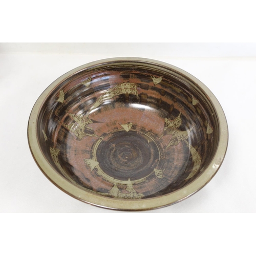 317 - Harry and May Davis Crowan Cornish studio pottery bowl of circular form with tenmoku glaze and wax r... 