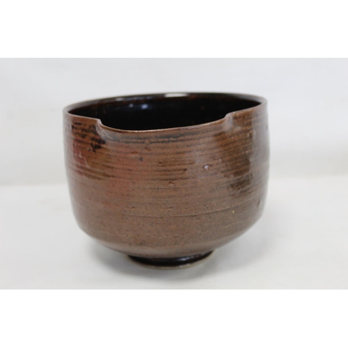 321 - 1970's studio pottery deep bowl of circular footed form with lip and tenmoku glaze, incised mark J.T... 