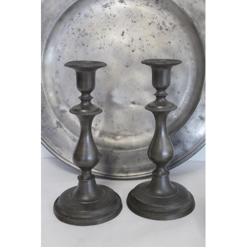 335 - Two large circular pewter chargers, each 42cm diam., with stamped initials M.R.D. (one split); a pew... 