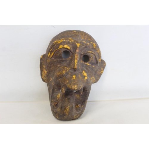 342 - Antique carved wooden mask of fierce monkey like form with fangs, probably a Noh mask, with traces o... 