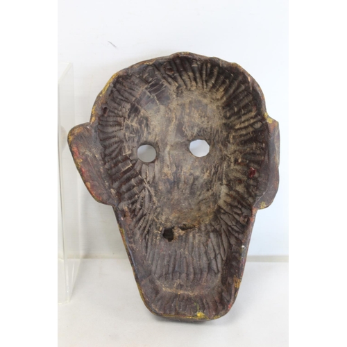 342 - Antique carved wooden mask of fierce monkey like form with fangs, probably a Noh mask, with traces o... 