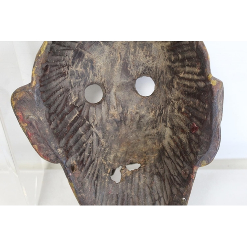 342 - Antique carved wooden mask of fierce monkey like form with fangs, probably a Noh mask, with traces o... 