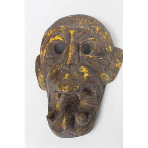 342 - Antique carved wooden mask of fierce monkey like form with fangs, probably a Noh mask, with traces o... 