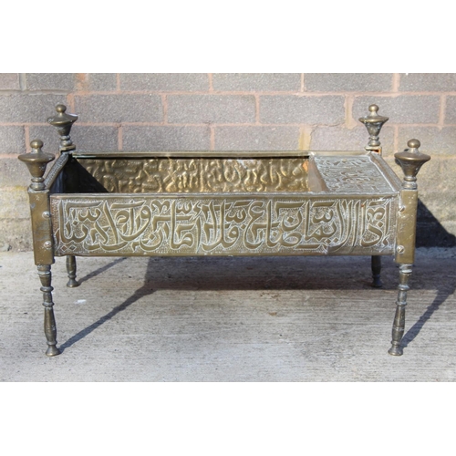 347 - Islamic Cairoware brass trough of rectangular twin handled form with two fixed handles and four turn... 