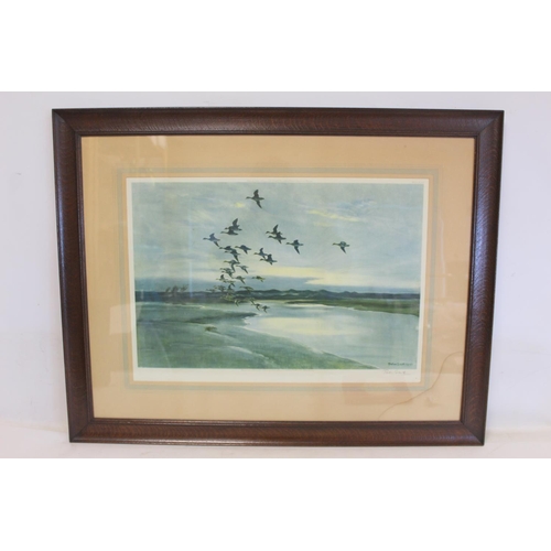 430 - Two Peter Scott colour prints of ducks flying over wetlands at dusk, both signed in pencil, 39cm x 5... 