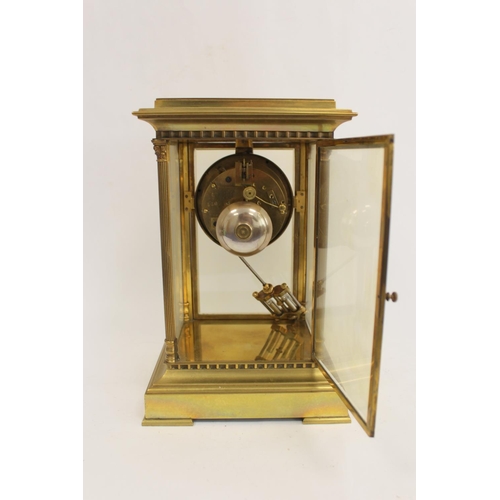 126 - French mantel clock of 'four glass' style with visible escapement, 'mercury' pendulum and fluted col... 