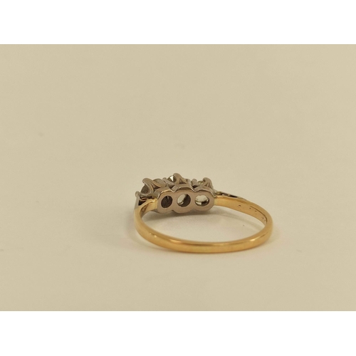 13 - Diamond three stone ring with old cut brilliants, the largest approx. 4mm in gold and platinum.