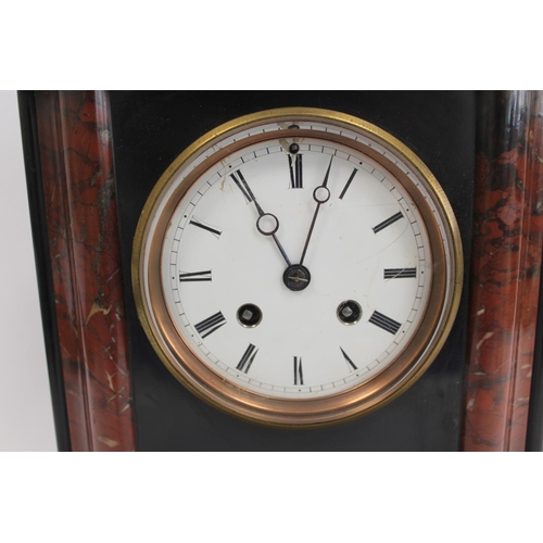 132 - French rouge and black marble mantel clock with shaped moulded sides and flat top. 16.5cm.