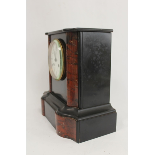 132 - French rouge and black marble mantel clock with shaped moulded sides and flat top. 16.5cm.