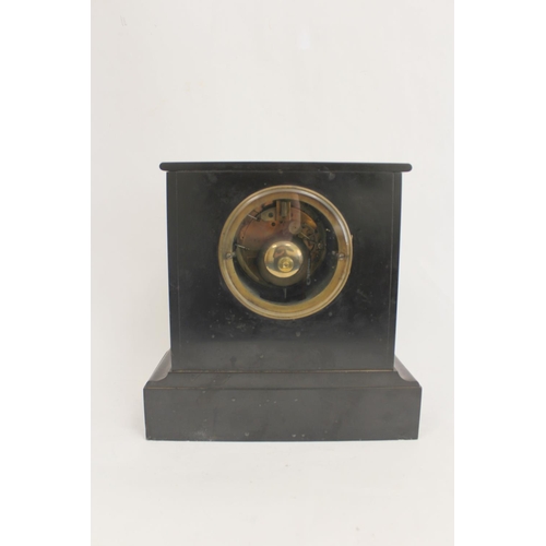 132 - French rouge and black marble mantel clock with shaped moulded sides and flat top. 16.5cm.