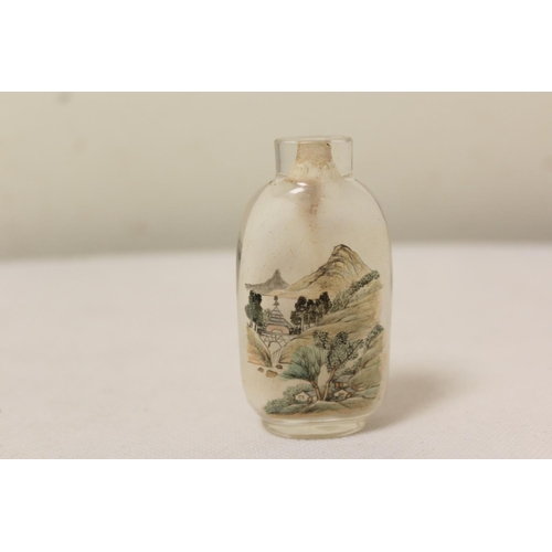 176 - Two antique Chinese inside painted glass snuff bottles, to include one of elongated form with mounta... 