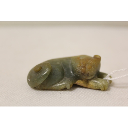 179 - Three Chinese archaic and archaised jade figures to include a repose cat figure, a rectangular toggl... 