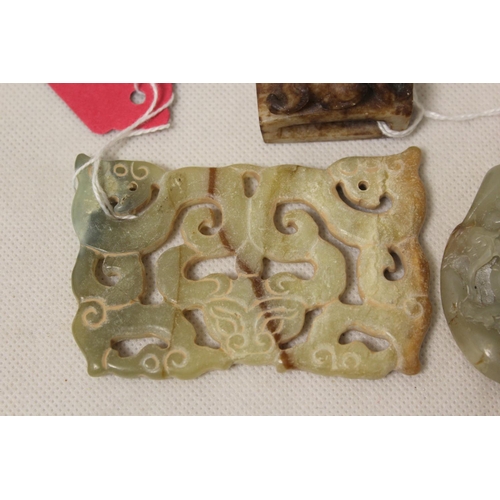 183 - Three Chinese archaic and archaised jade carvings, to include a green jade stone with a dragon relie... 