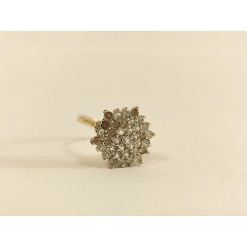 63 - Paste cluster ring in gold, probably 18ct. Size 'P'. 