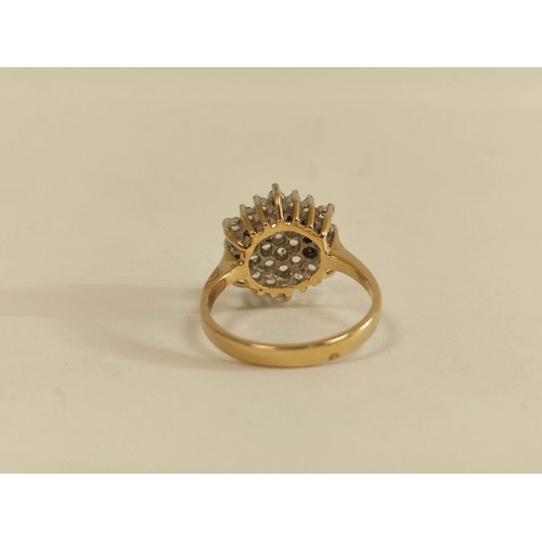 63 - Paste cluster ring in gold, probably 18ct. Size 'P'. 