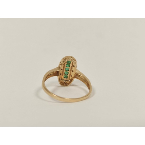 66 - Finger ring with five square emeralds, surrounded by small diamonds, in 9ct gold. Size 'U'.