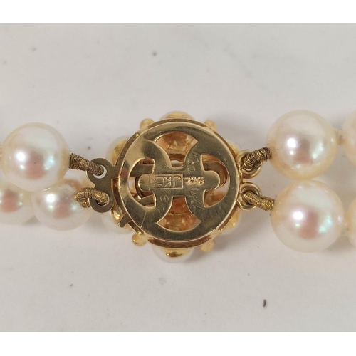 73 - Cultured pearl necklace, opera length adaptable to form a two row on 9ct gold pearl cluster snap.