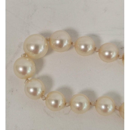 74 - Graduated cultured pearl necklace on 18ct coloured gold ovoid snap.