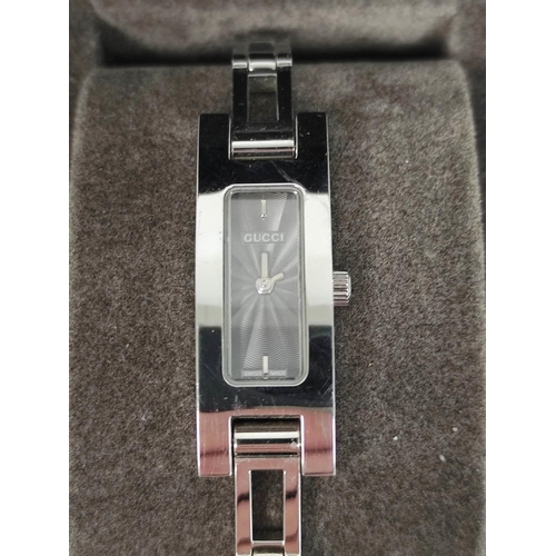 76 - Gucci lady's evening watch, boxed, a pink spinel and diamond pendant in 9ct gold.