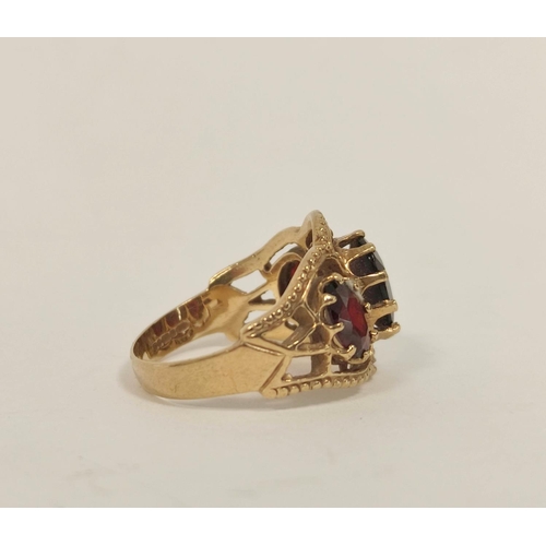 79 - Garnet three stone ring in 9ct gold. Size 'O'.