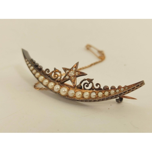 9 - Victorian gold crescent brooch with graduated pearls and diamond set star. 5.4g. 53mm