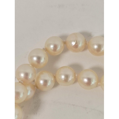 98 - Two row necklace of cultured pearls on similar 9ct gold snap.