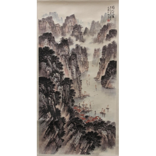 195 - Two Chinese reproduction scroll paintings (prints), one depicting a mountainous river gorge with vil... 