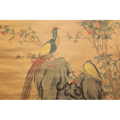 196 - Reproduction Chinese scroll painting (print) depicting two golden pheasants perched on a rock surrou... 