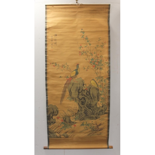 196 - Reproduction Chinese scroll painting (print) depicting two golden pheasants perched on a rock surrou... 